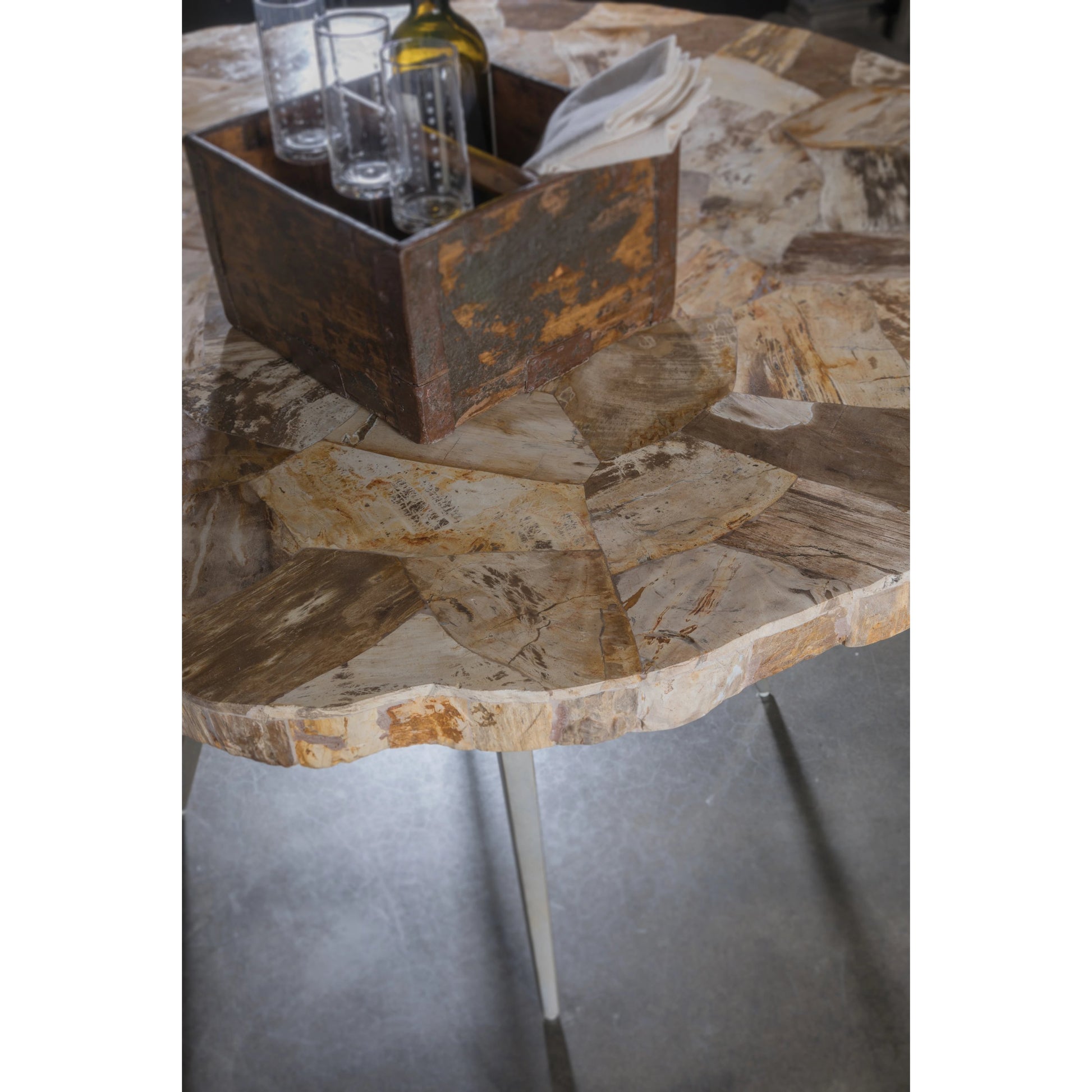Caldera Round Dining Table by Artistica Home in silver. Made from unique in a modern style.