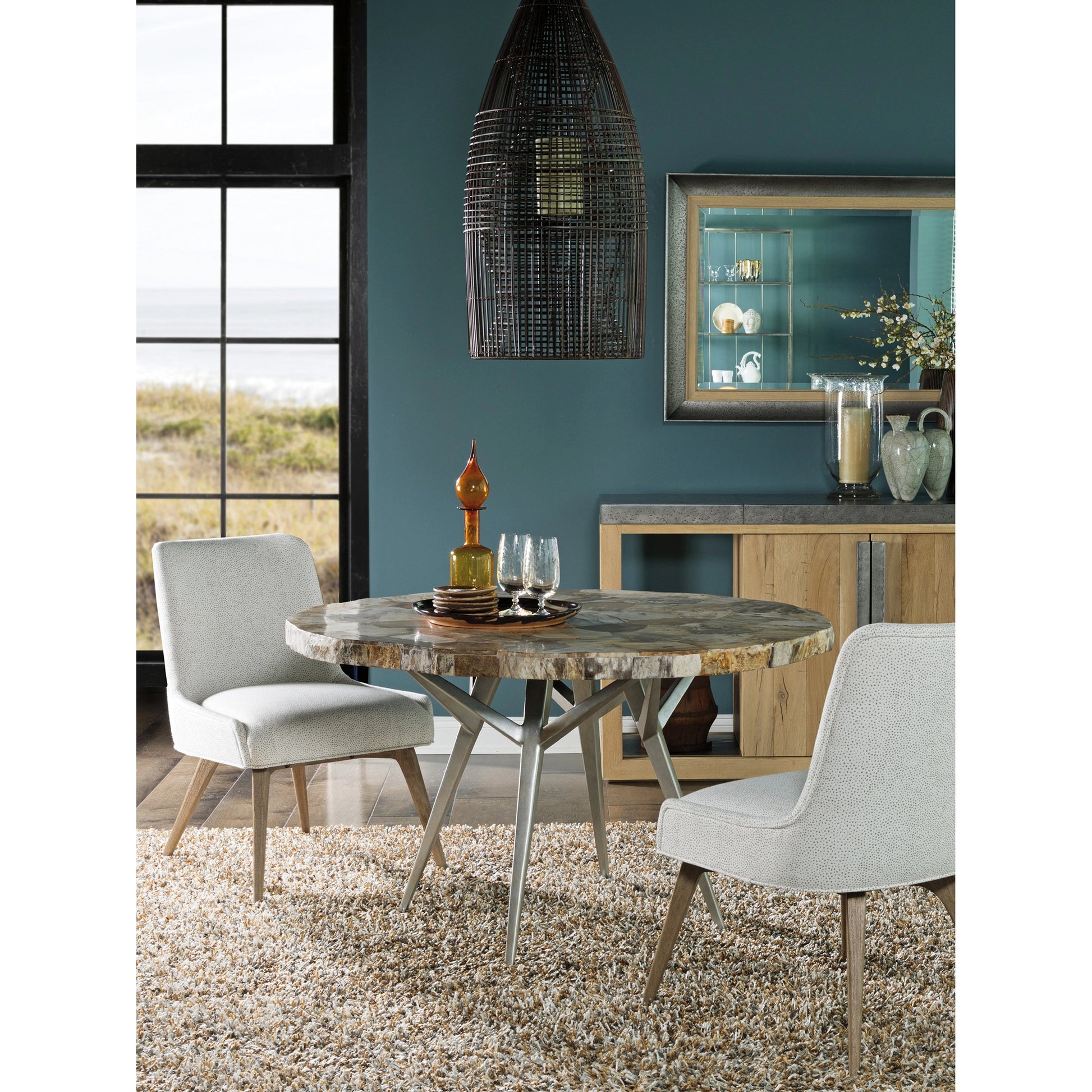 Caldera Round Dining Table by Artistica Home in silver. Made from unique in a modern style.