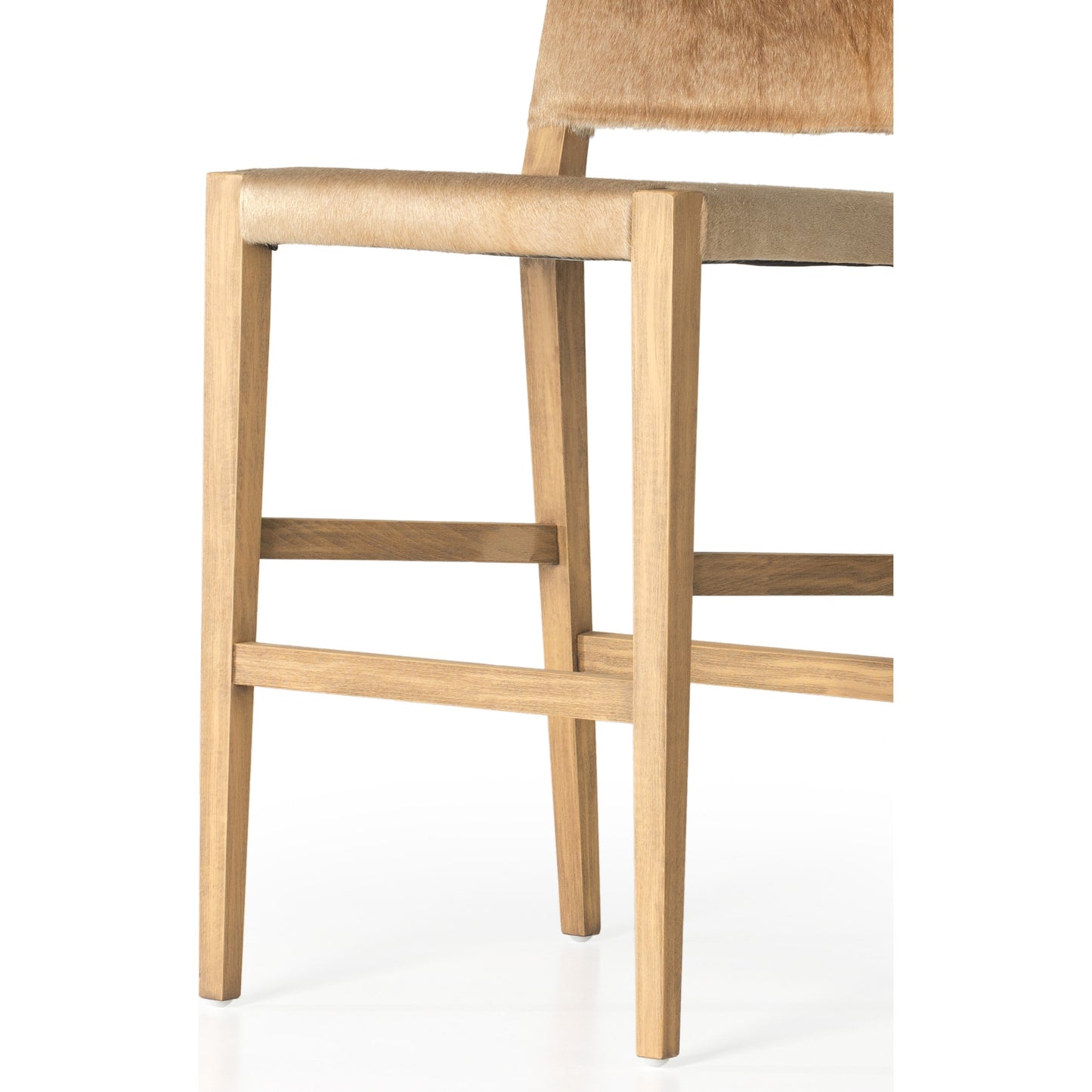 011 SI-1903065 | Closeup | Villa Bar Stool by Four Hands in light hair on hide, natural beech. Made from hair on hide, solid beech, iron in a modern style.