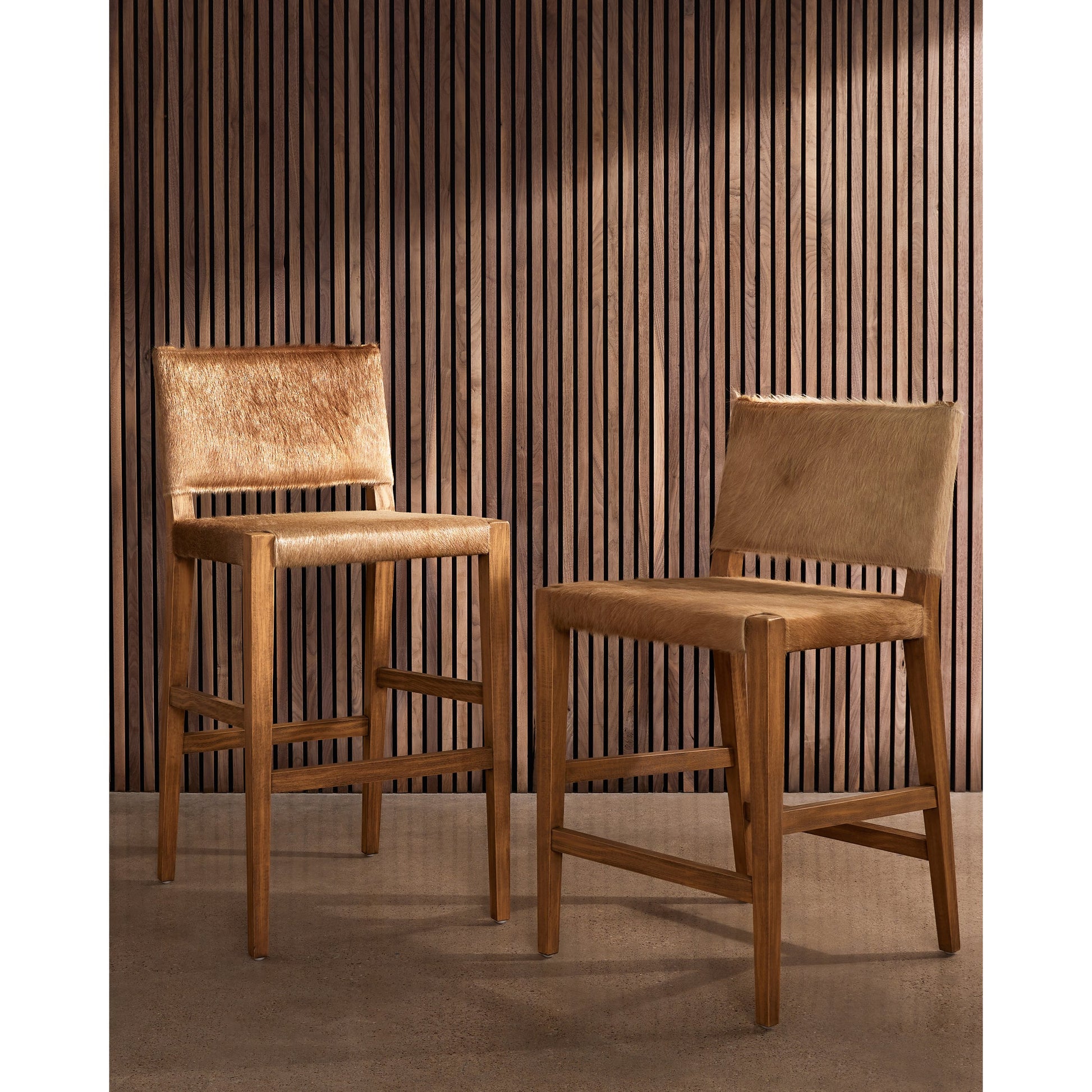 Villa Bar Stool by Four Hands in light hair on hide, natural beech. Made from hair on hide, solid beech, iron in a modern style.