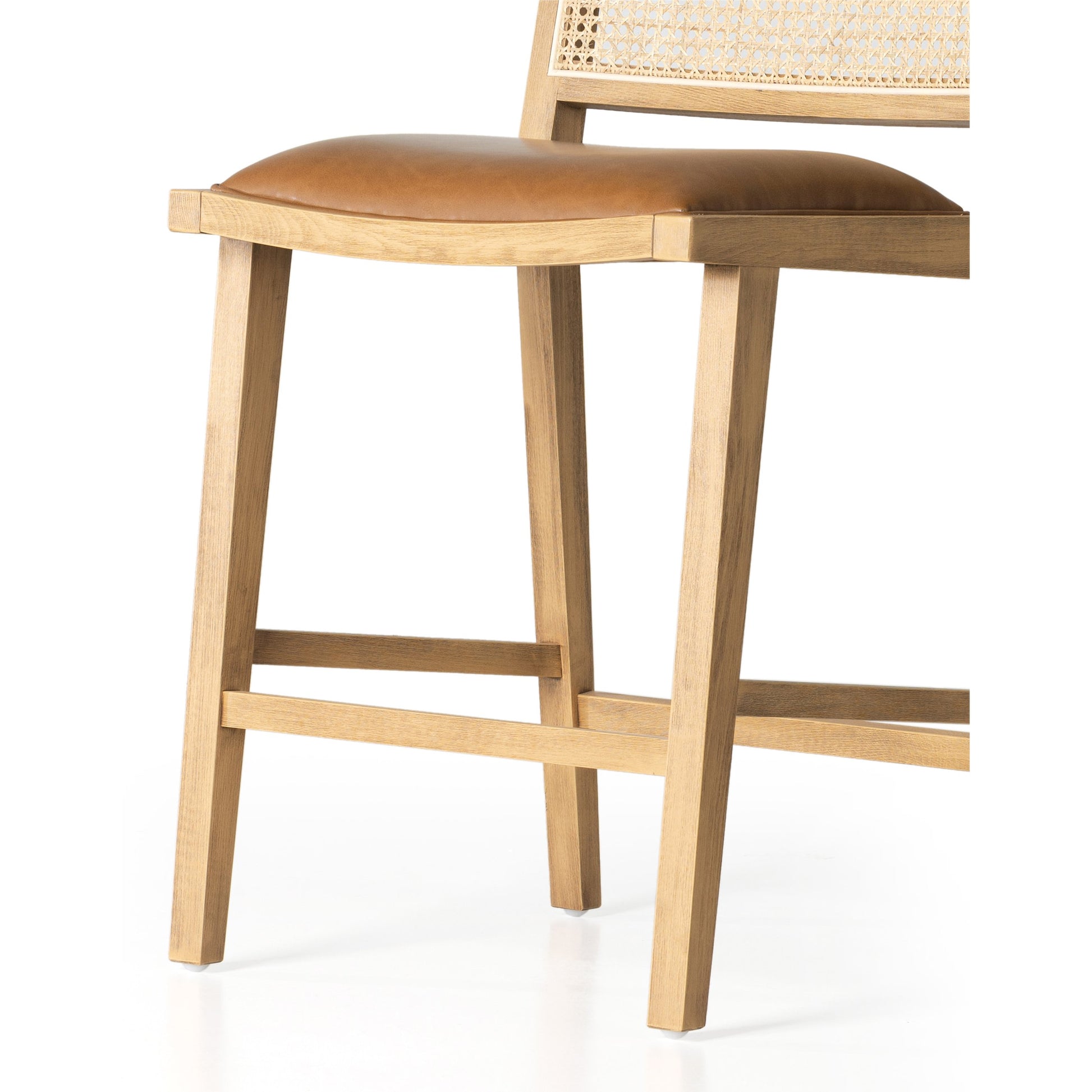 Sage Counter Stool by Four Hands in natural cane, sierra butterscotch. Made from faux leather, solid beech, cane in a coastal style.