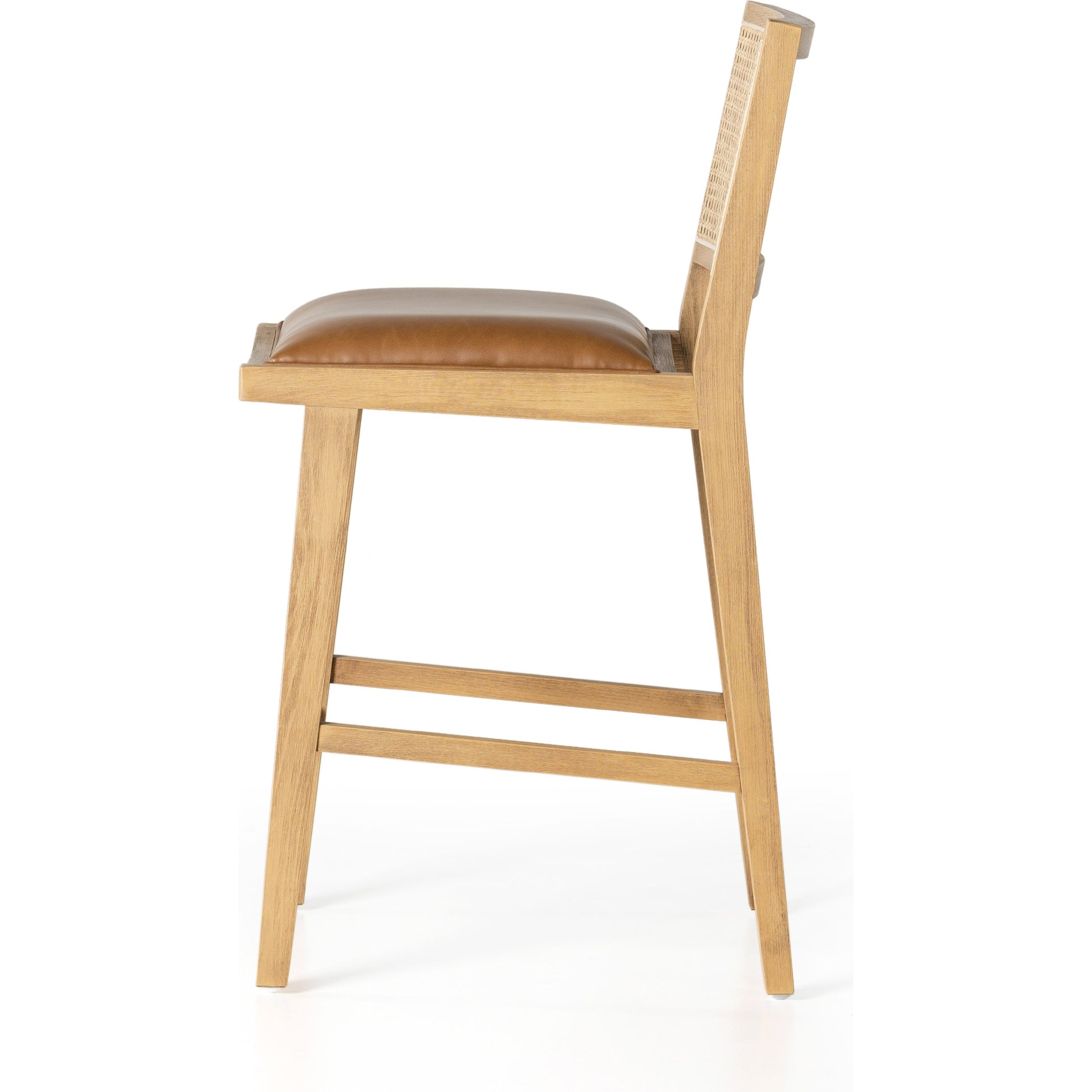 Sage Counter Stool by Four Hands in natural cane, sierra butterscotch. Made from faux leather, solid beech, cane in a coastal style.