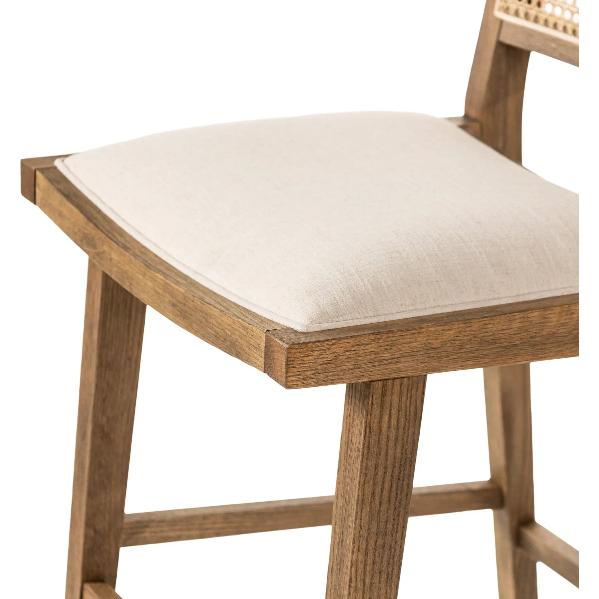 Sage Bar Stool by Four Hands in savile flax, toasted oak, natural cane. Made from 92% polyester, 8% flax/linen, solid oak, cane in a rustic style.
