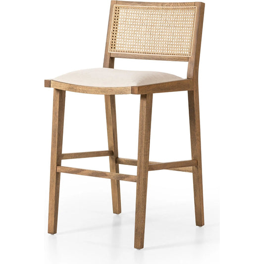 Sage Bar Stool by Four Hands in savile flax, toasted oak, natural cane. Made from 92% polyester, 8% flax/linen, solid oak, cane in a unique style.