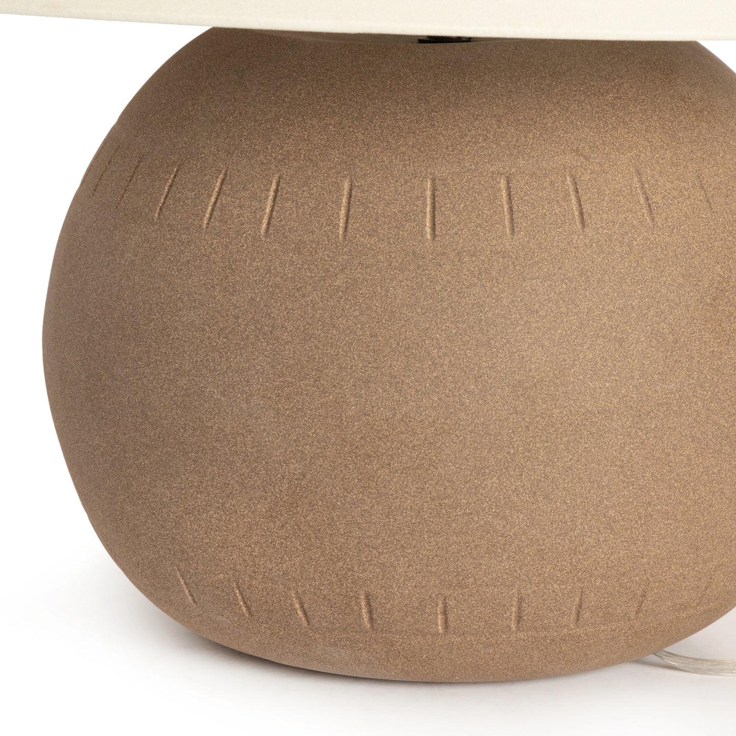 003 SI-1977379 | Closeup | Honus Table Lamp by Four Hands in dark sand, ivory linen. Made from ceramic, 65% polyester, 35% flax, linen, thermoplastic in a modern style.
