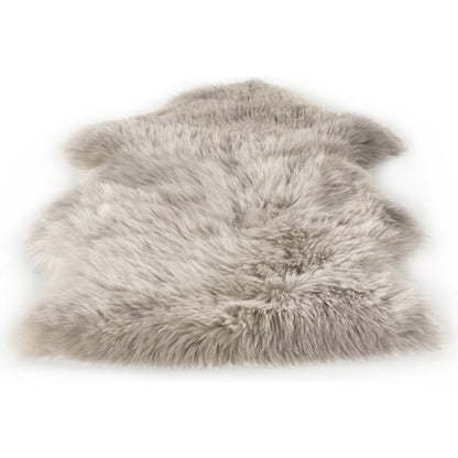 Lalo Ombre Throw by Four Hands. Made from shearling in a transitional style.