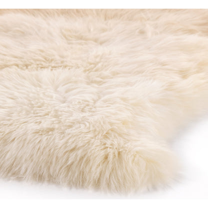 Lalo Ombre Throw by Four Hands. Made from shearling in a transitional style.