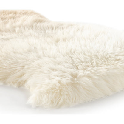 Lalo Ombre Throw by Four Hands. Made from shearling in a transitional style.