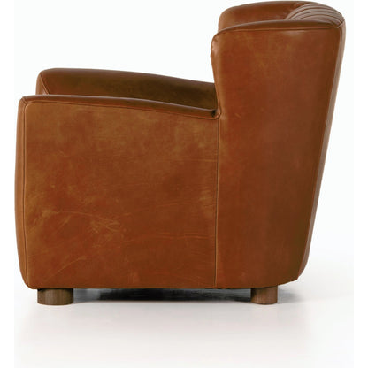 Elora Chair by Four Hands in sheepskin camel. Made from 100% polyester, solid parawood, 100% polypropylene in a transitional style.