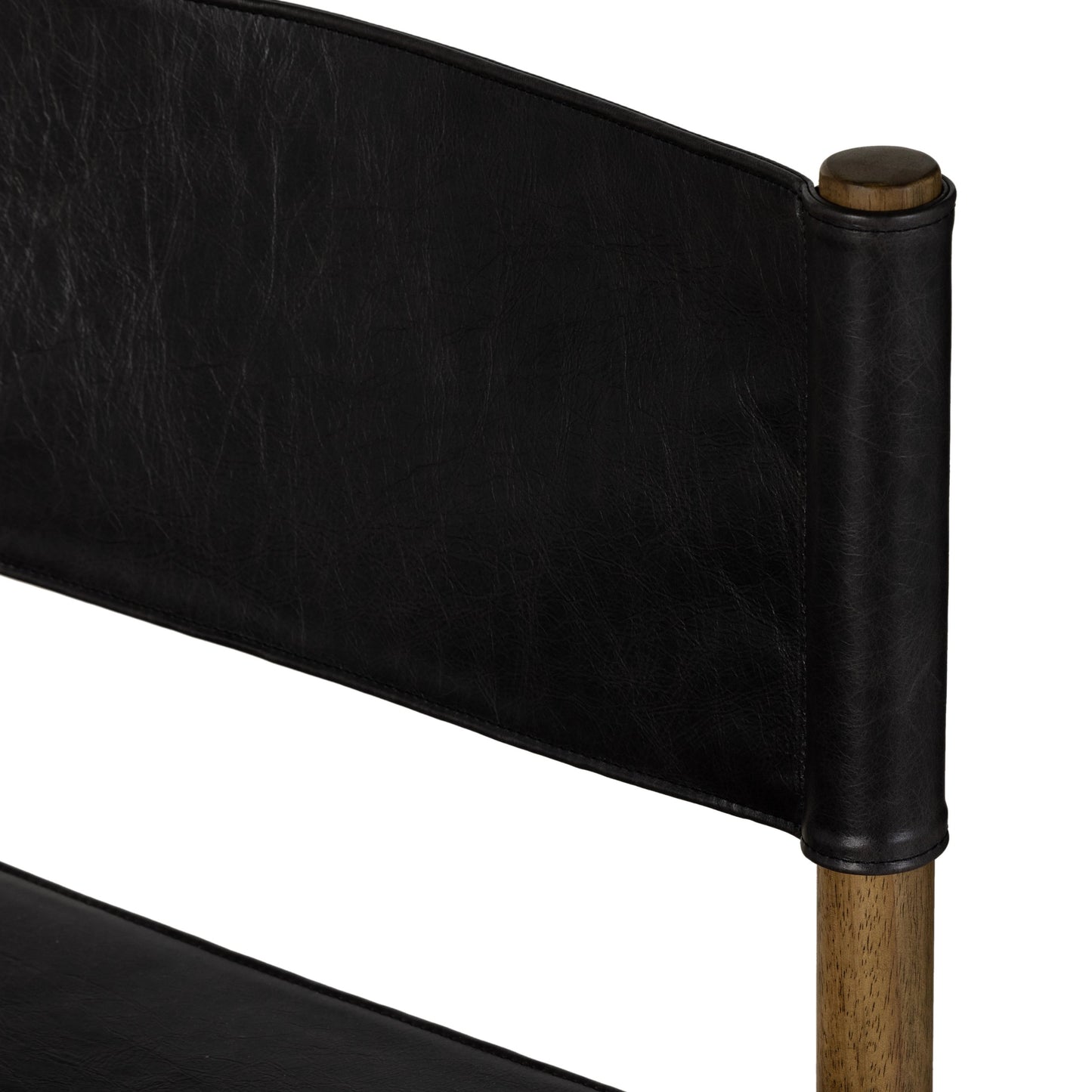 010 SI-1977440 | Closeup | Kena Dining Chair by Four Hands in sonoma black, vintage natural. Made from top grain leather, solid parawood in a modern style.