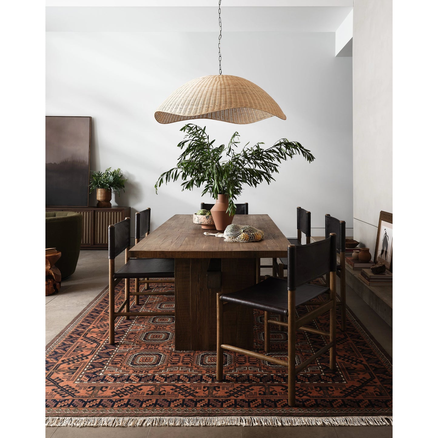 012 SI-1977440 | Lifestyle | Kena Dining Chair by Four Hands in sonoma black, vintage natural. Made from top grain leather, solid parawood in a modern style.
