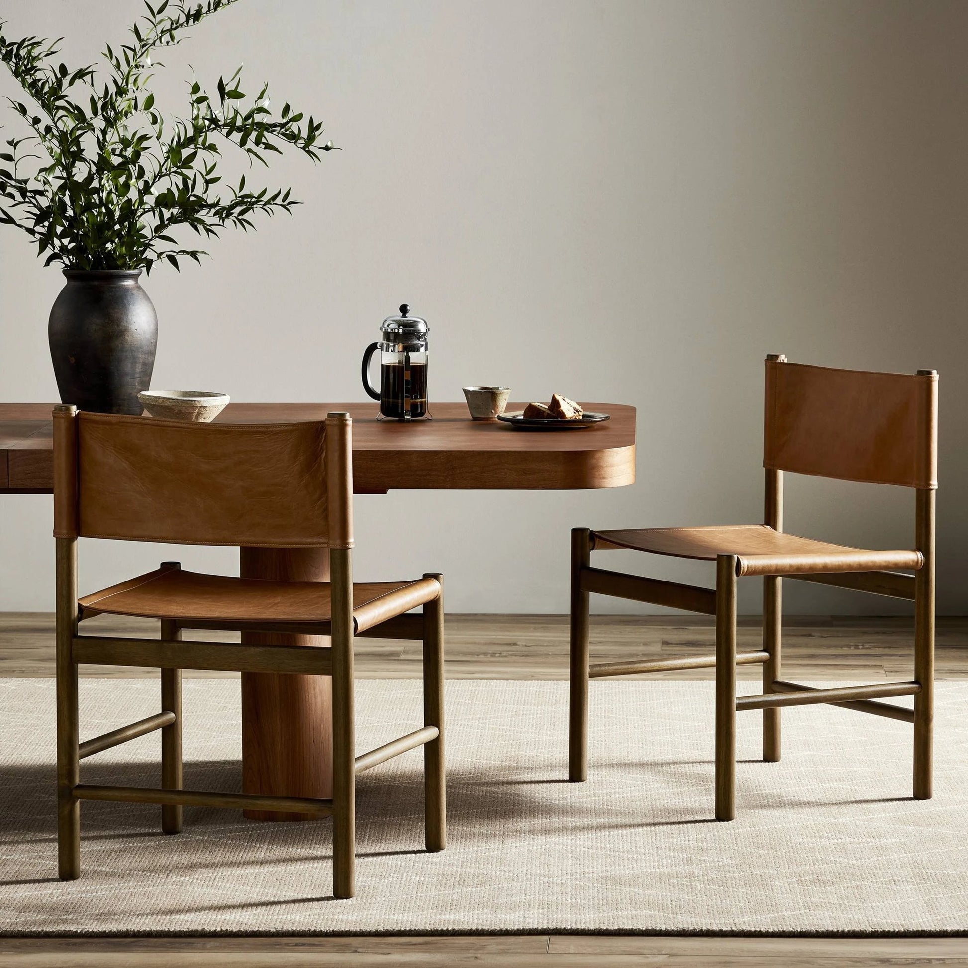 Kena Dining Chair by Four Hands. Made from top grain leather, solid parawood in a modern style.