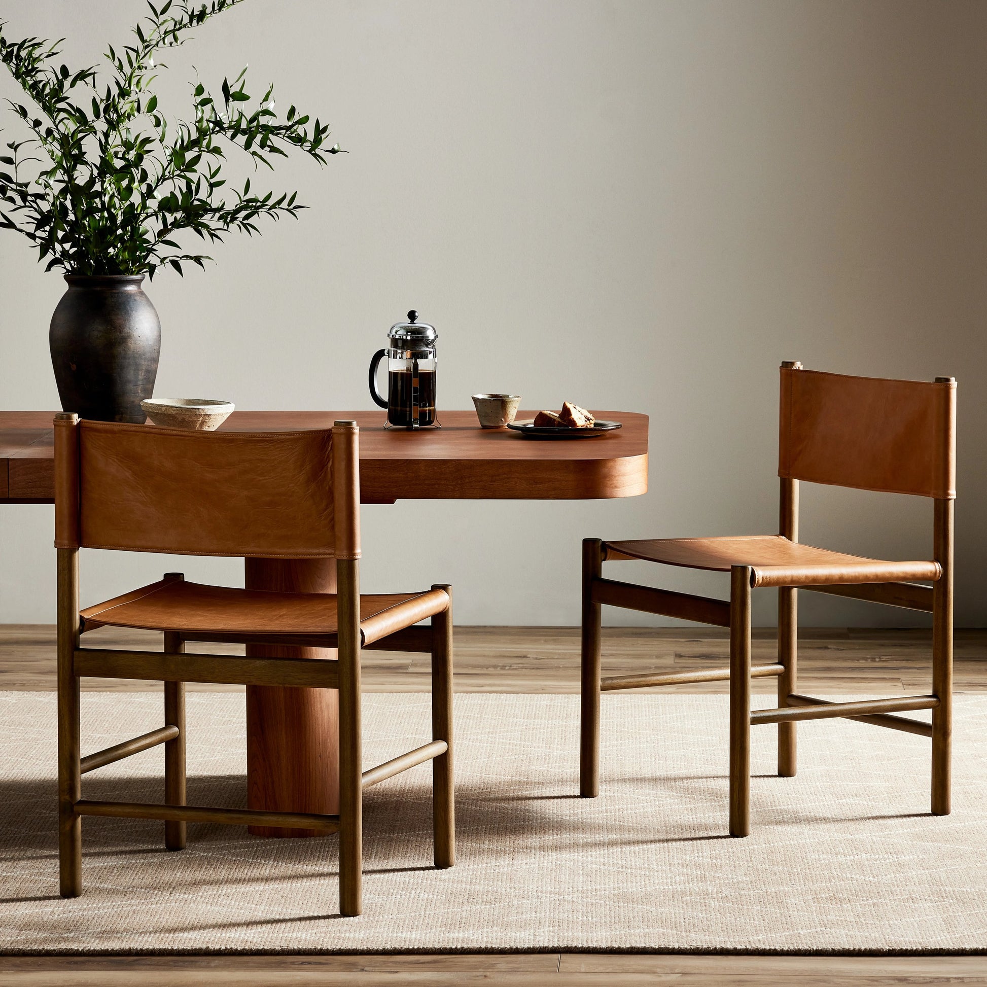 Kena Dining Chair by Four Hands. Made from top grain leather, solid parawood in a modern style.