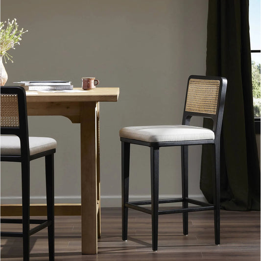Veka Counter Stool by Four Hands in brushed ebony, savile flax. Made from 92% polyester, 8% flax, linen, solid beech, cane in a coastal style.