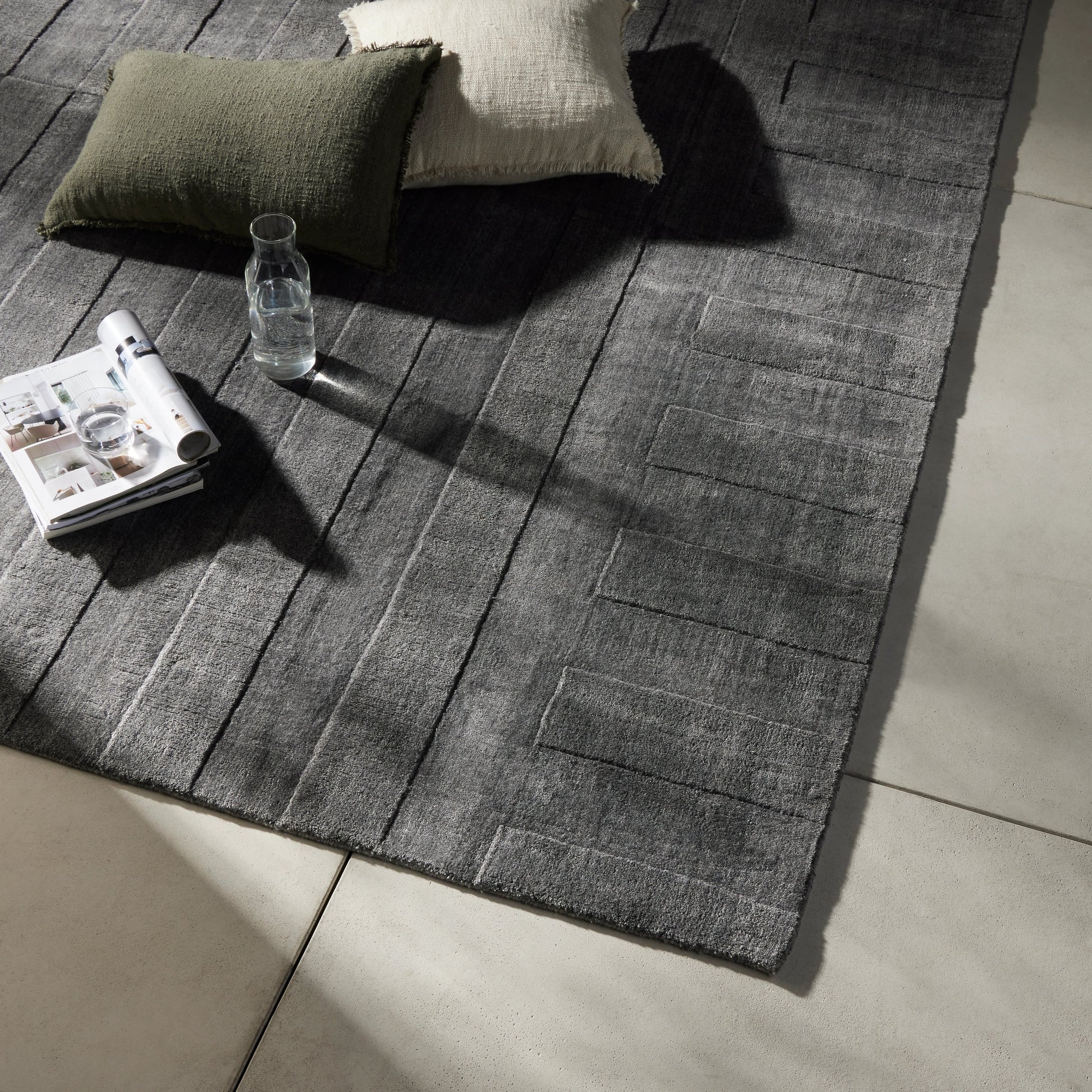 Ario Outdoor Rug by Four Hands in shadowed stripe. Made from 100% polyethylene terephthalate (pet) in a modern style.