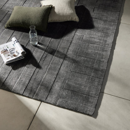 Ario Outdoor Rug by Four Hands in shadowed stripe. Made from 100% polyethylene terephthalate (pet) in a modern style.
