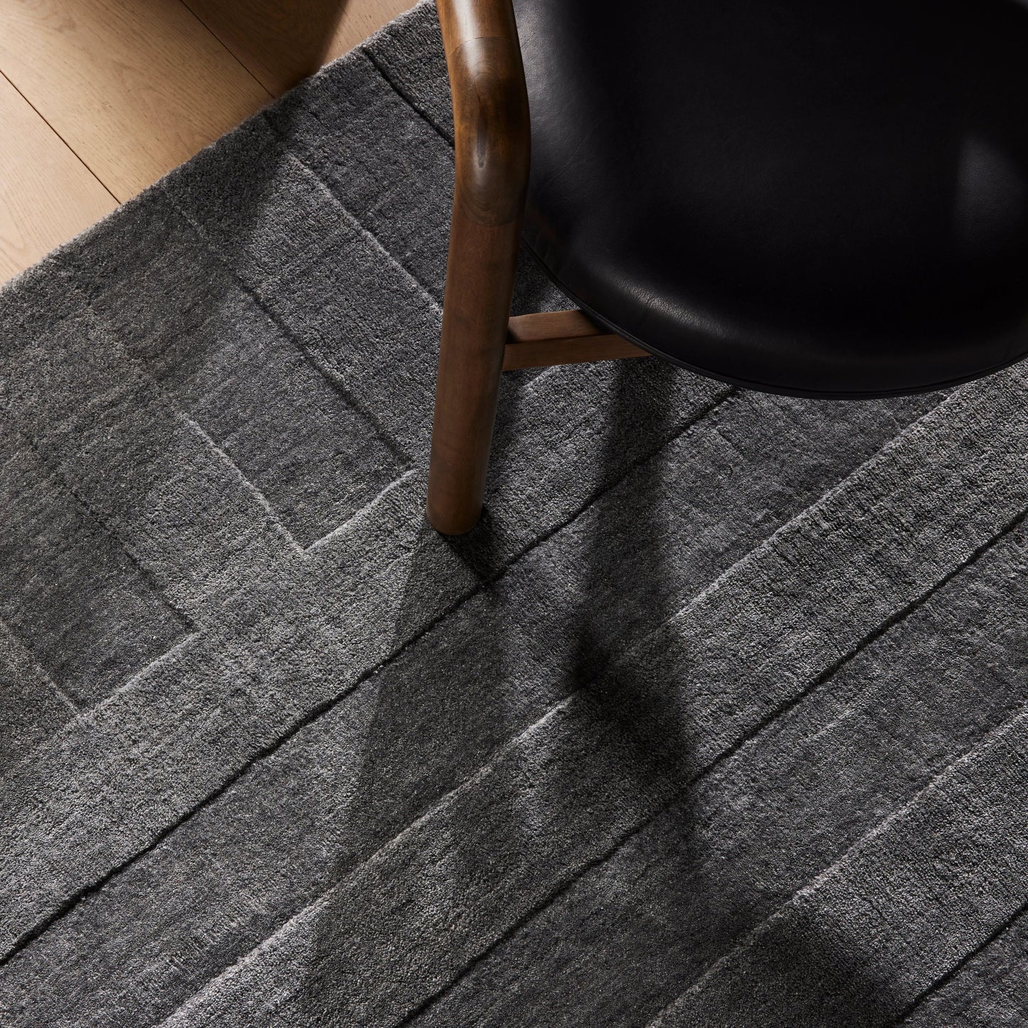014 SI-1980077 | Lifestyle | Ario Outdoor Rug by Four Hands in shadowed stripe. Made from 100% polyethylene terephthalate (pet) in a modern style.