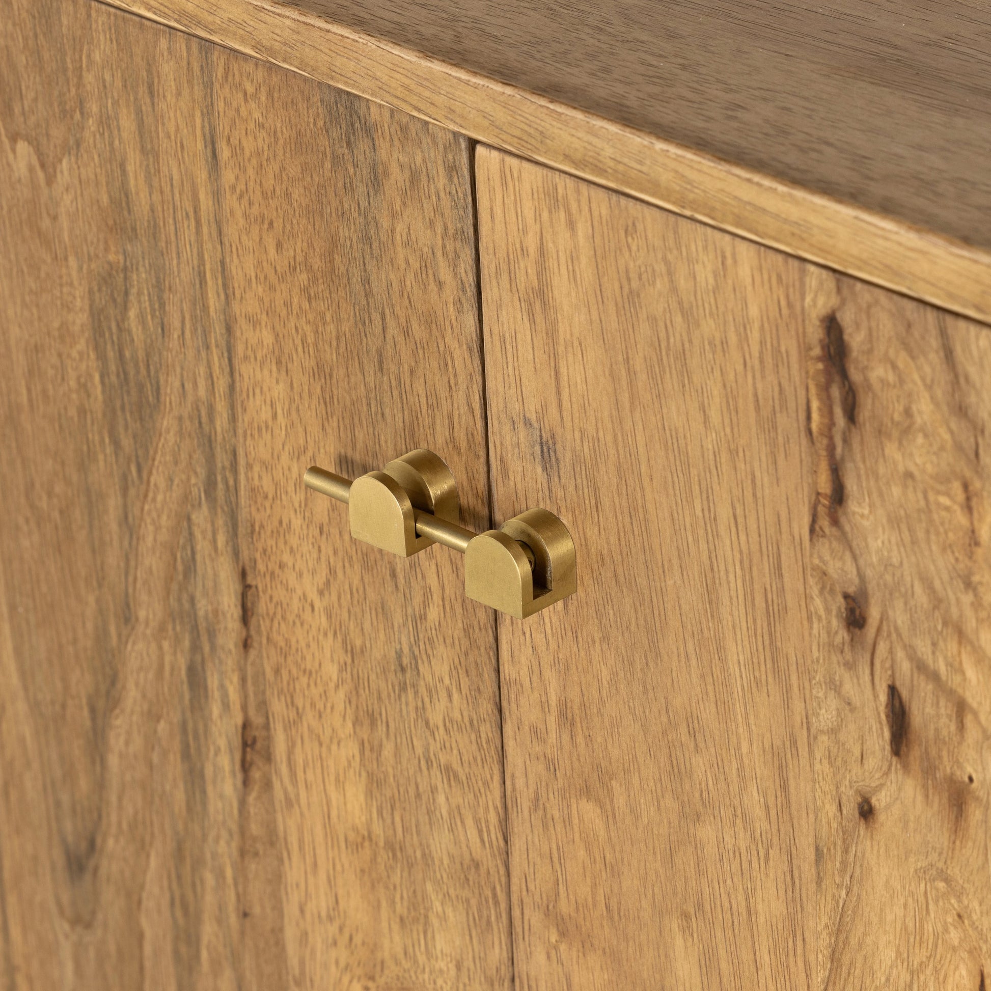 Reza Wide Bookcase by Four Hands in smoked honey, raw brass, toasted acacia. Made from solid acacia, solid parawood in a modern style.