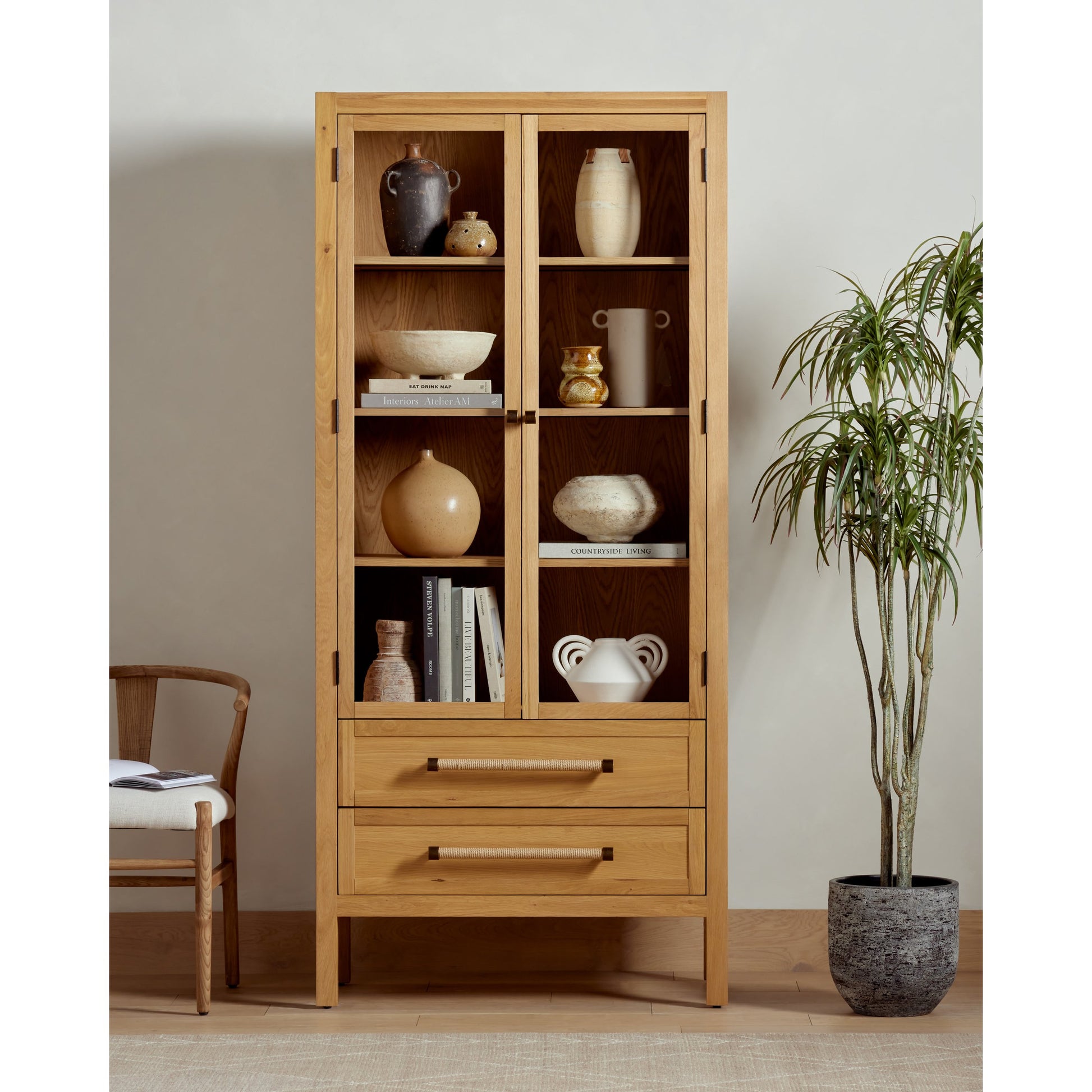 Laker Cabinet by Four Hands in black oak. Made from solid oak, rush, oak veneer in a cottage & farmhouse style.