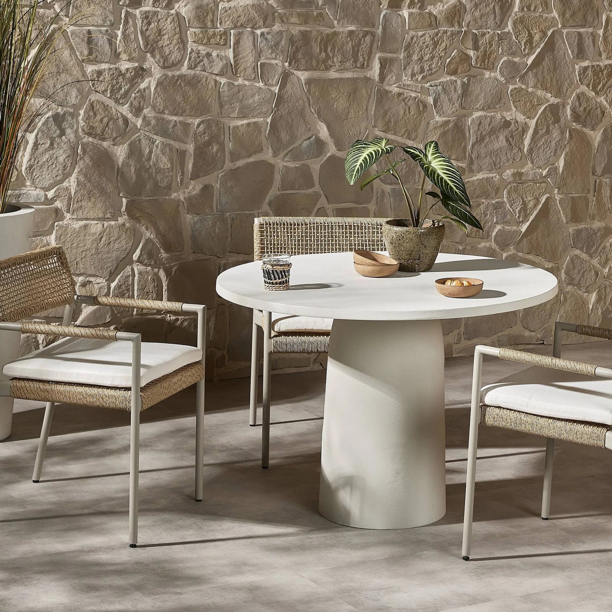 Basil Outdoor Dining Table by Four Hands. Made from aluminum in a modern style.