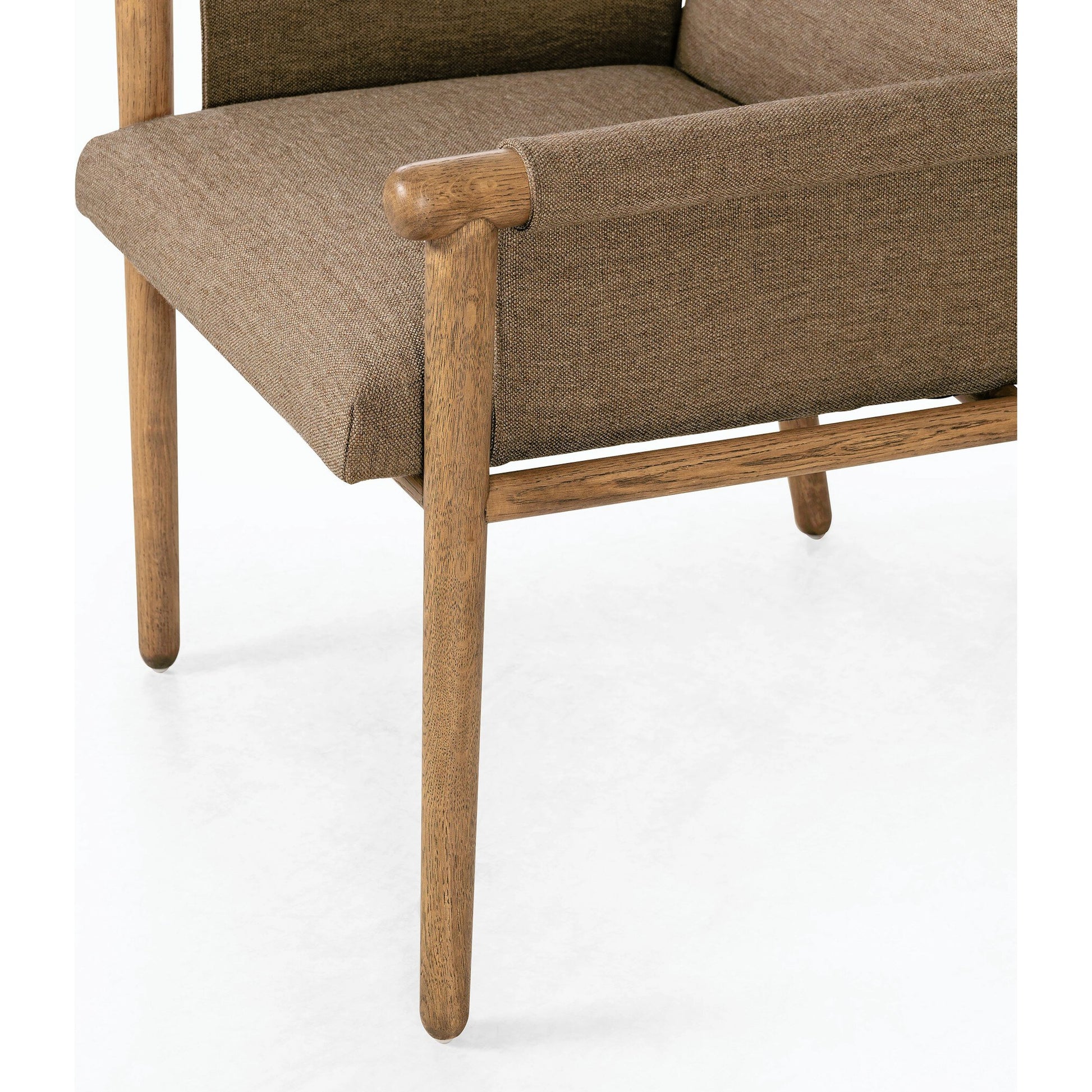 Almada Dining Armchair by Four Hands in valencia camel, distressed natural. Made from top grain leather, solid parawood, 100% polyester in a transitional style.