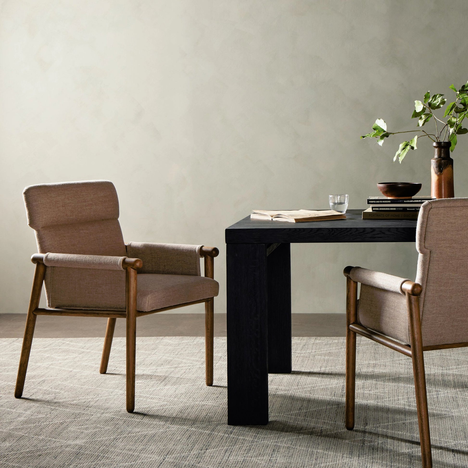 Almada Dining Armchair by Four Hands in valencia camel, distressed natural. Made from top grain leather, solid parawood, 100% polyester in a transitional style.