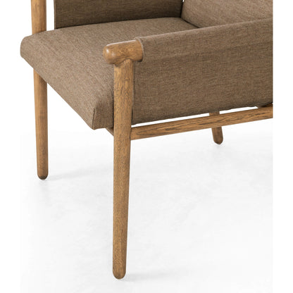 Almada Dining Armchair by Four Hands in valencia camel, distressed natural. Made from top grain leather, solid parawood, 100% polyester in a transitional style.