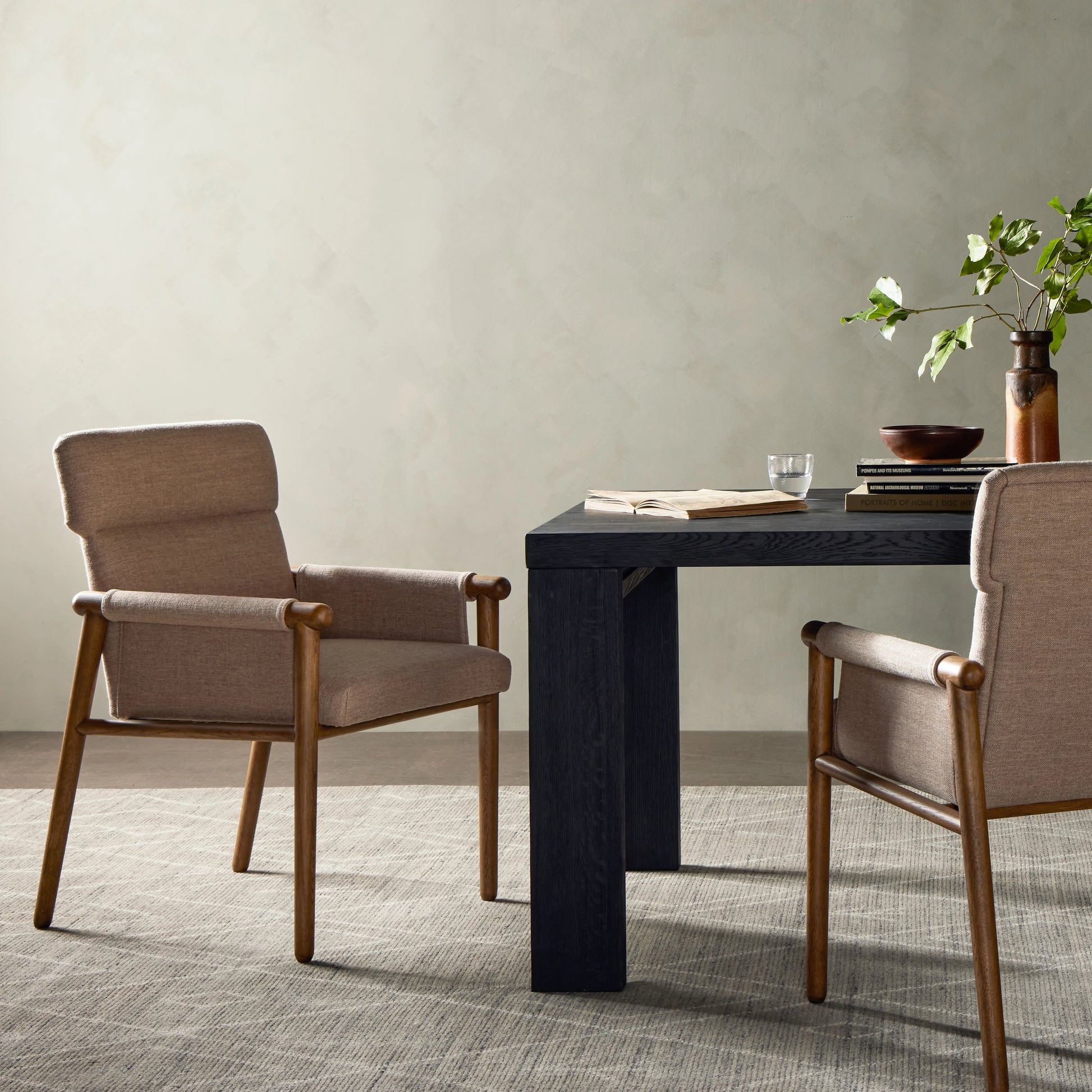 Almada Dining Armchair by Four Hands in valencia camel, distressed natural. Made from top grain leather, solid parawood, 100% polyester in a transitional style.