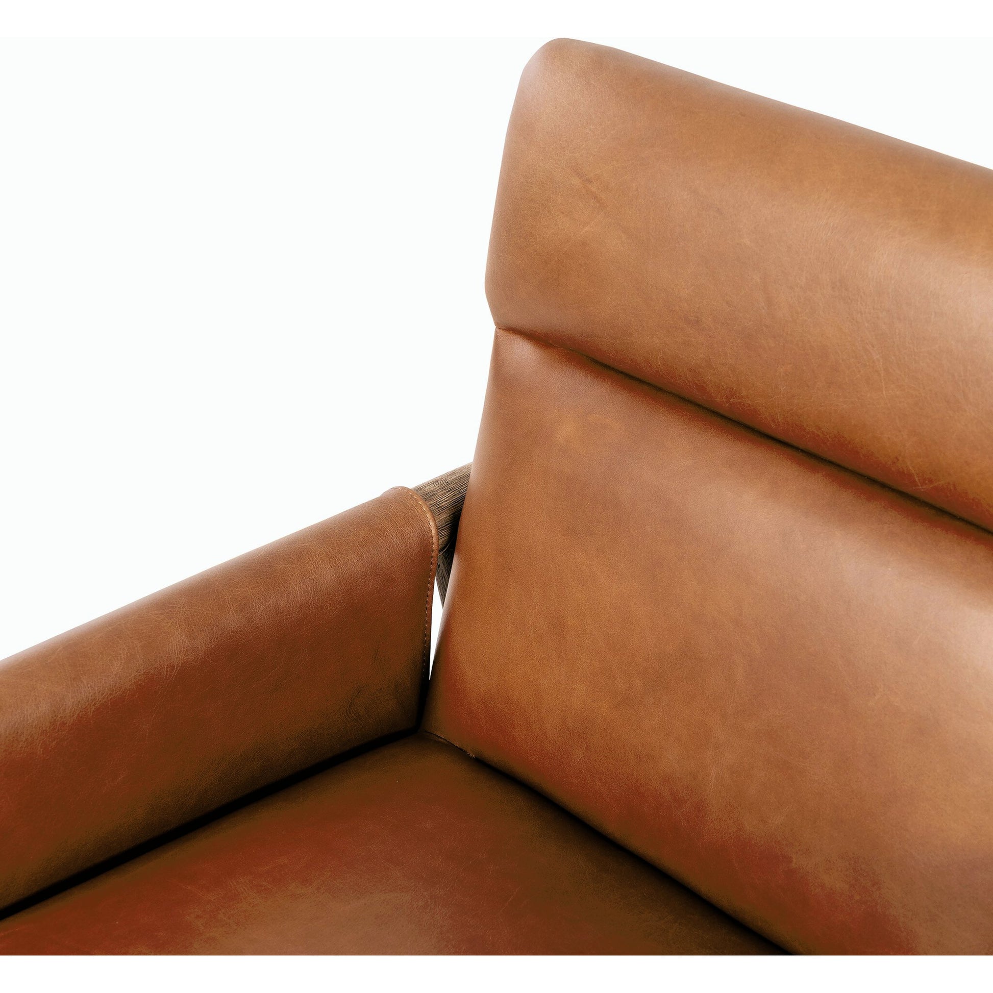 Almada Dining Armchair by Four Hands in valencia camel, distressed natural. Made from top grain leather, solid parawood, 100% polyester in a transitional style.