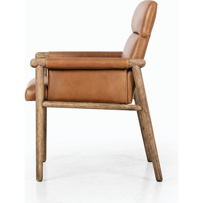 Almada Dining Armchair by Four Hands in valencia camel, distressed natural. Made from top grain leather, solid parawood, 100% polyester in a transitional style.