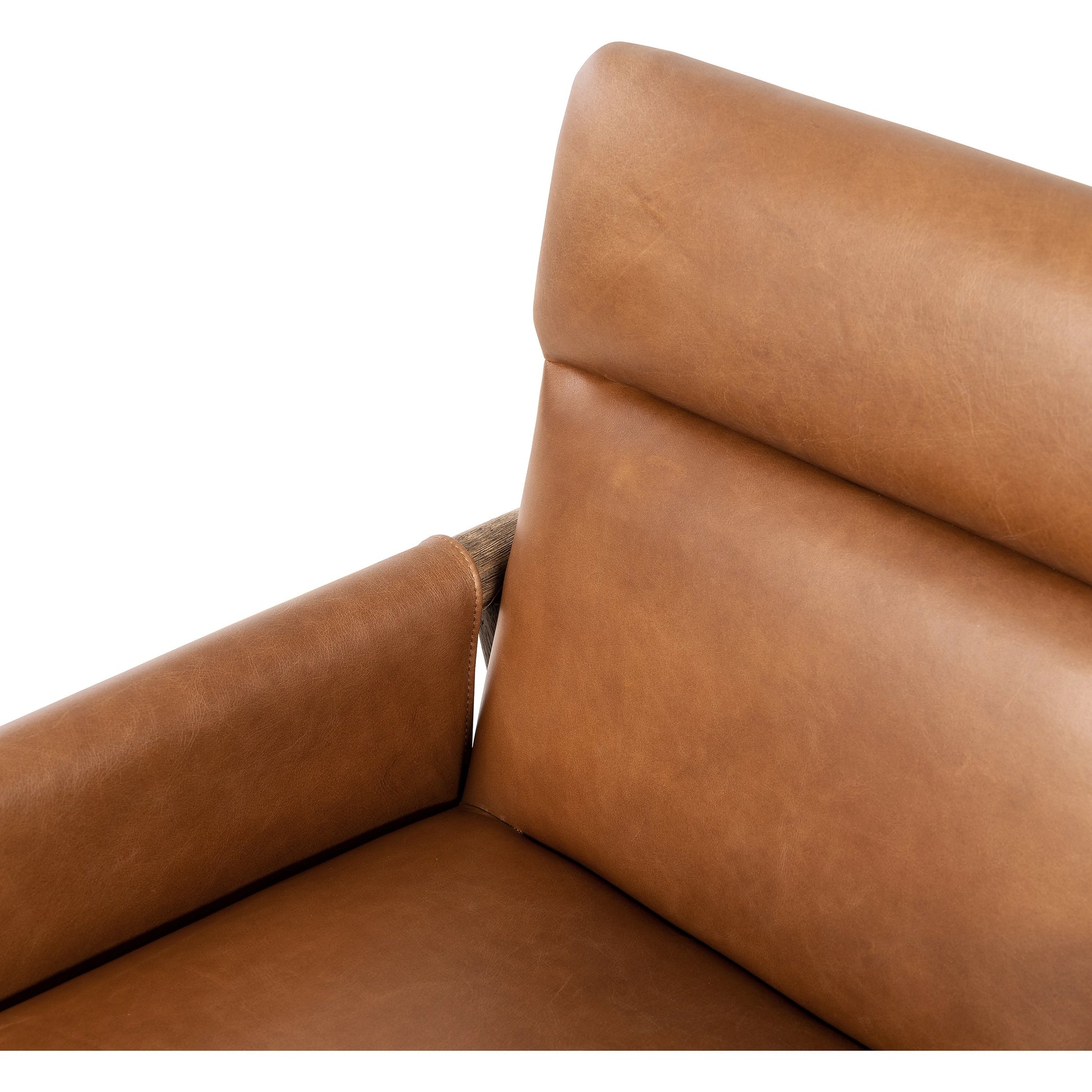 Almada Dining Armchair by Four Hands in valencia camel, distressed natural. Made from top grain leather, solid parawood, 100% polyester in a transitional style.