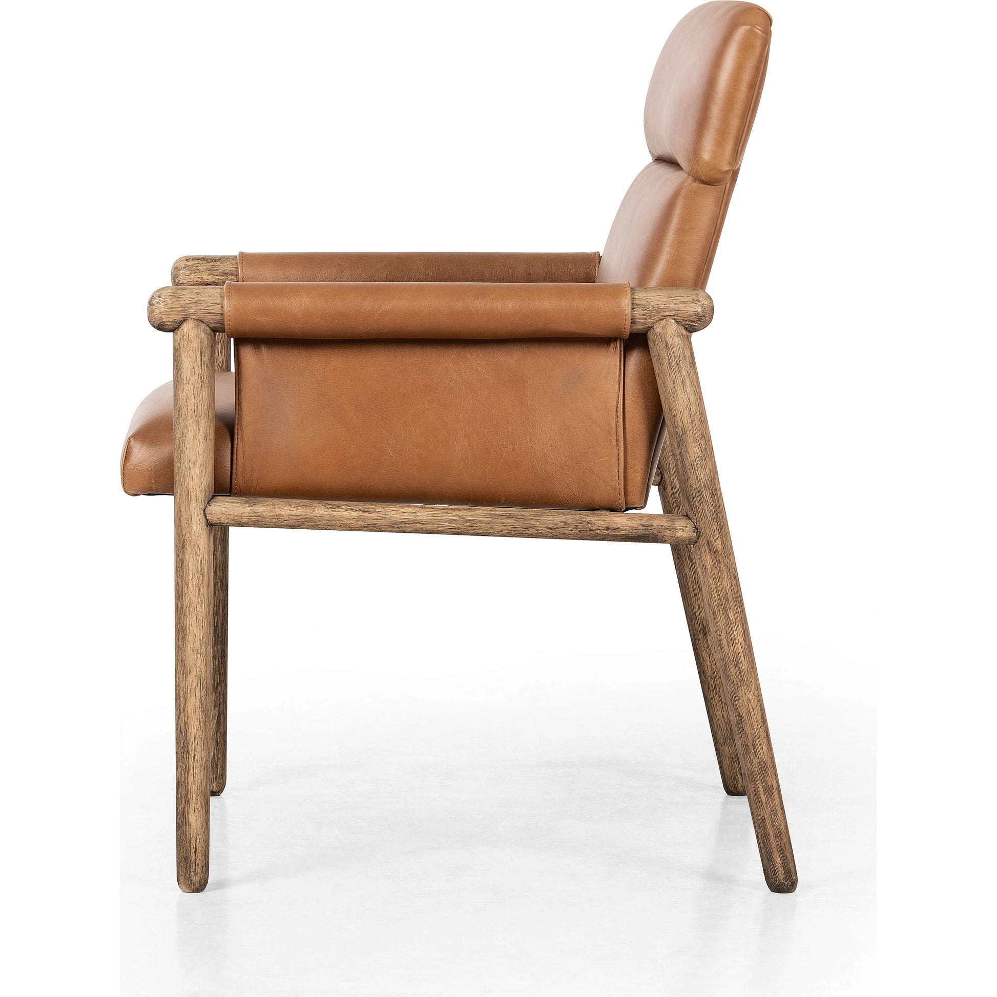 Almada Dining Armchair by Four Hands in valencia camel, distressed natural. Made from top grain leather, solid parawood, 100% polyester in a transitional style.