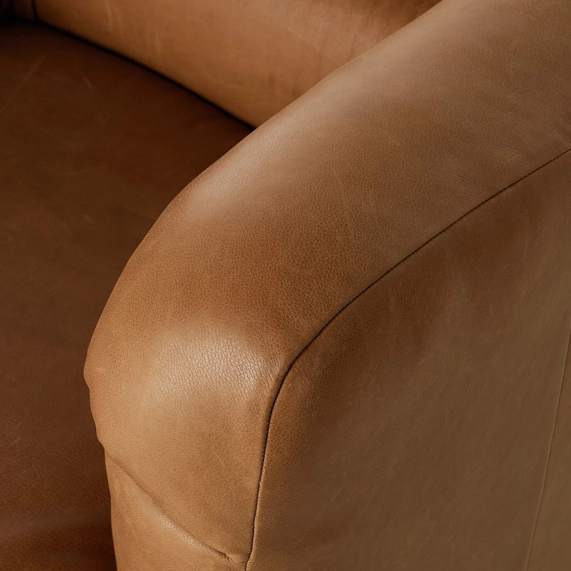 Gerrie Swivel Chair by Four Hands in brickhouse butterscotch. Made from top grain leather in a unique style.