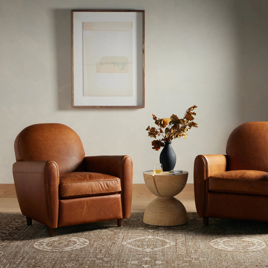 Osborne Chair by Four Hands in raleigh chestnut, almond. Made from top grain leather, solid parawood, 100% polyester in a modern style.