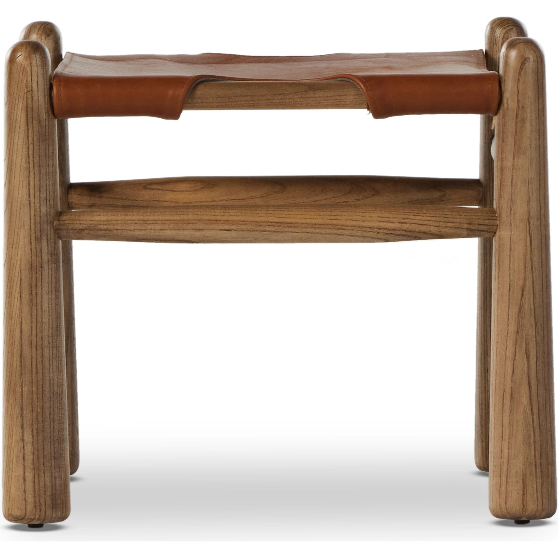 Nino Ottoman by Four Hands in dakota tobacco. Made from top grain leather, solid nettlewood, 100% polyester in a modern style.