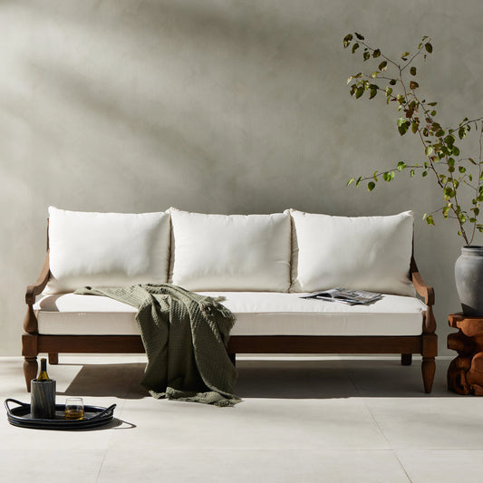 Alameda Outdoor Sofa by Four Hands in venao ivory, heritage brown. Made from 100% olefin, solid fsc® reclaimed teak, 91% polyurethane foam pad, 9% polyester fiber batting in a traditional style.