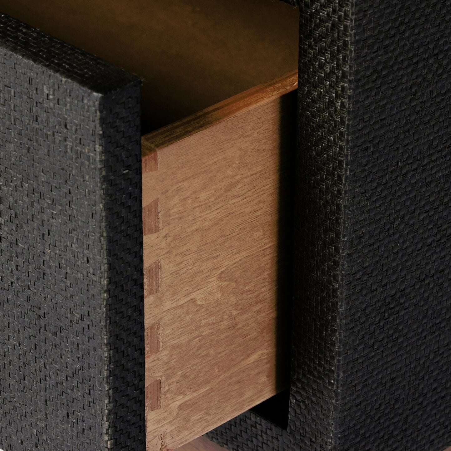 010 SI-2001312 | Closeup | Fiona Nightstand by Four Hands in black raffia, russet mahogany, light antique brass. Made from sugar palm, solid mahogany, iron in a modern style.