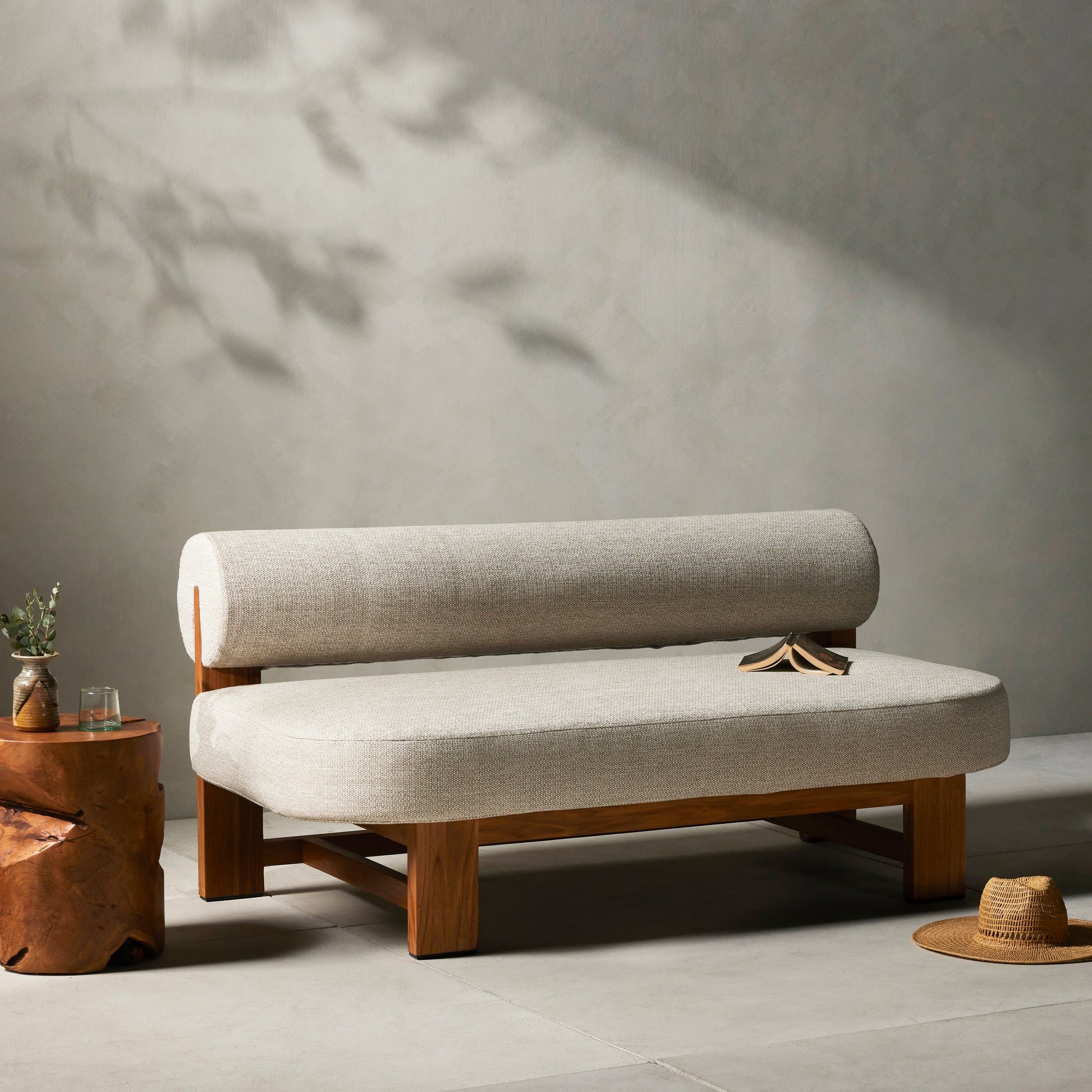 Malta Outdoor Sofa by Four Hands in faye sand. Made from 100% olefin, solid fsc®-certified teak, 91% polyurethane foam pad, 9% polyester fiber batting in a modern style.