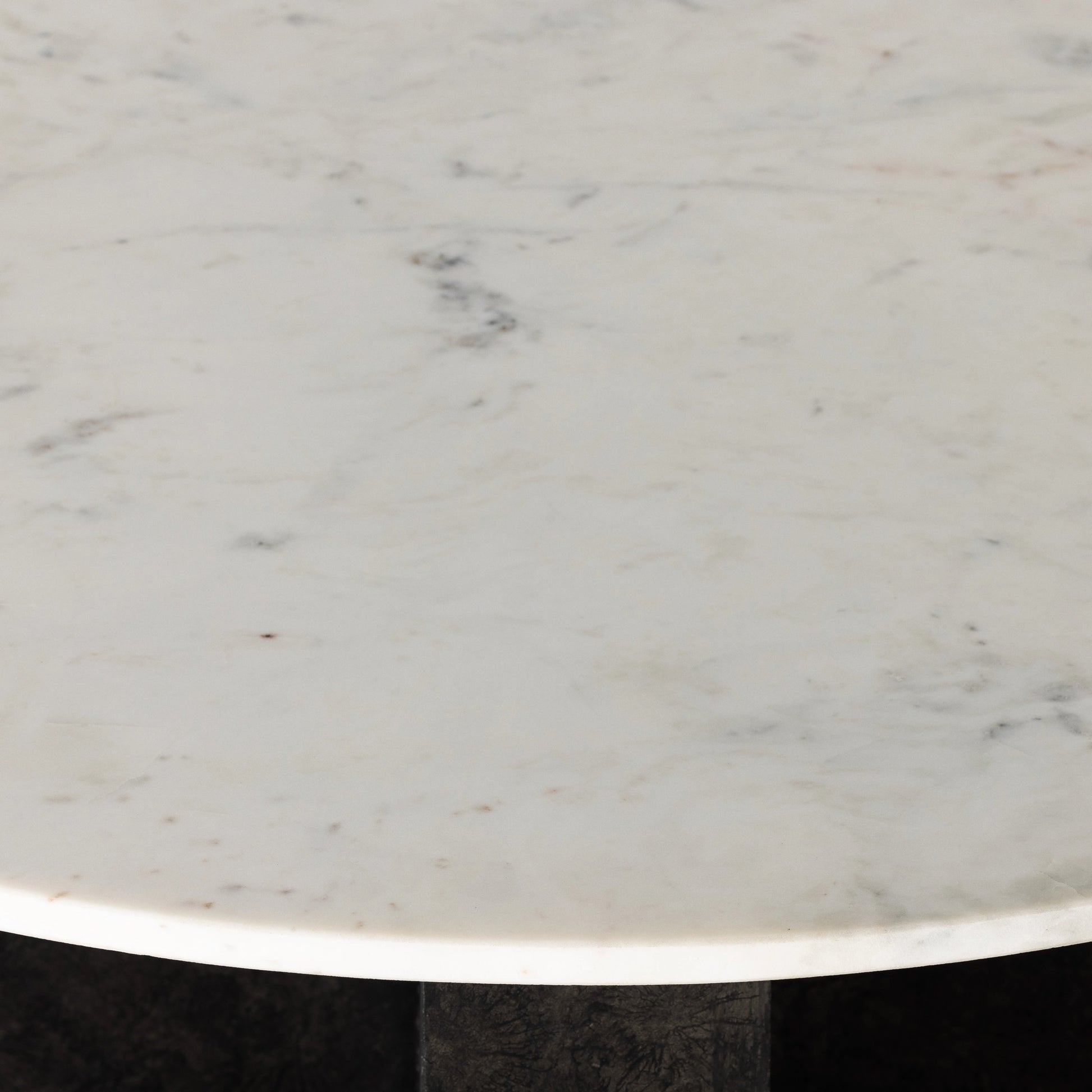 Terrell Round Coffee Table by Four Hands in raw black, polished white marble. Made from solid marble, aluminum, engineered hardwood in a modern style.