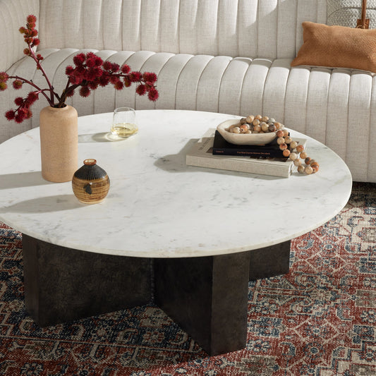 Terrell Round Coffee Table by Four Hands in raw black, polished white marble. Made from solid marble, aluminum, engineered hardwood in a modern style.