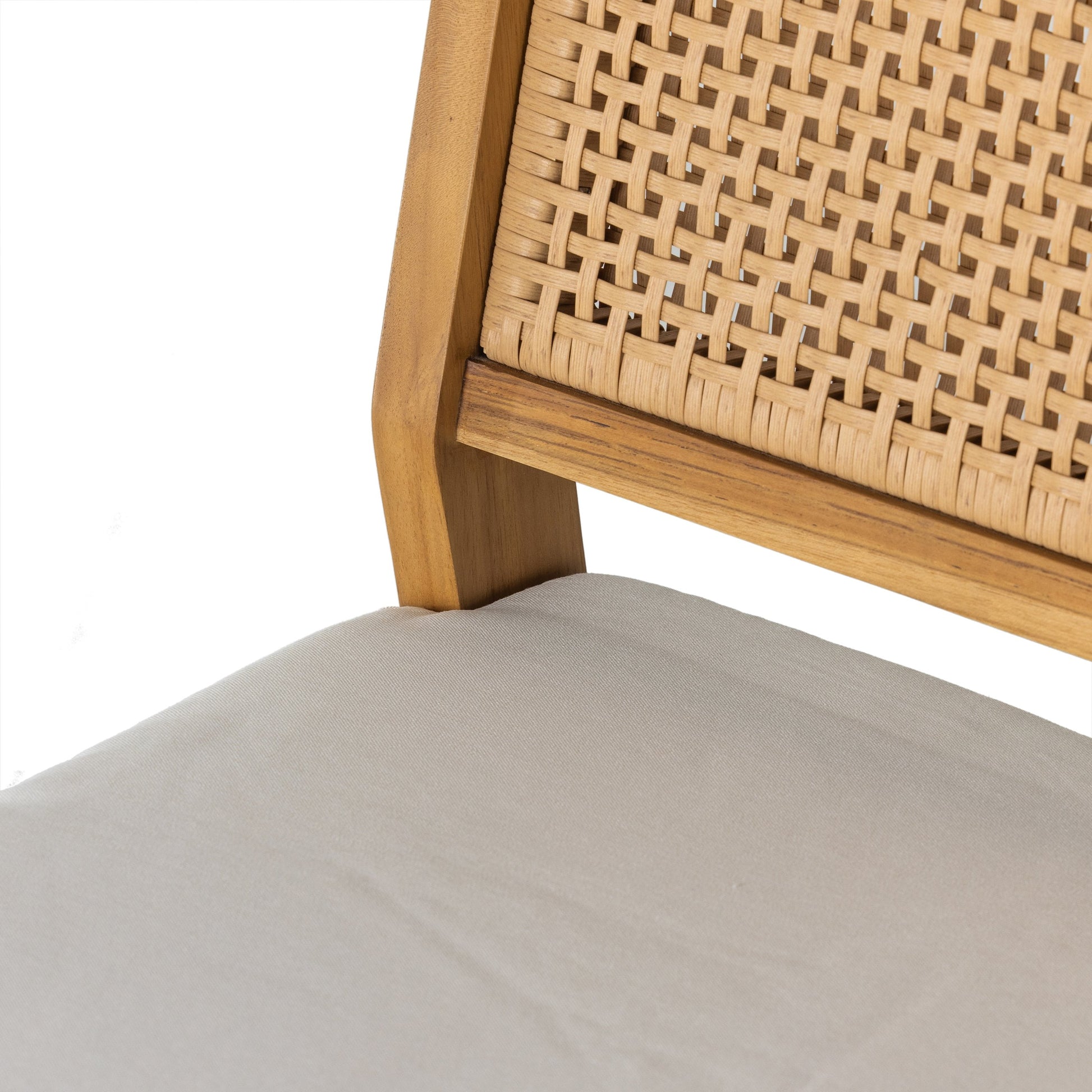 Merit Outdoor Dining Chair by Four Hands in faux rattan, natural teak. Made from solid fsc®-certified teak, 100% polyethylene in a transitional style.