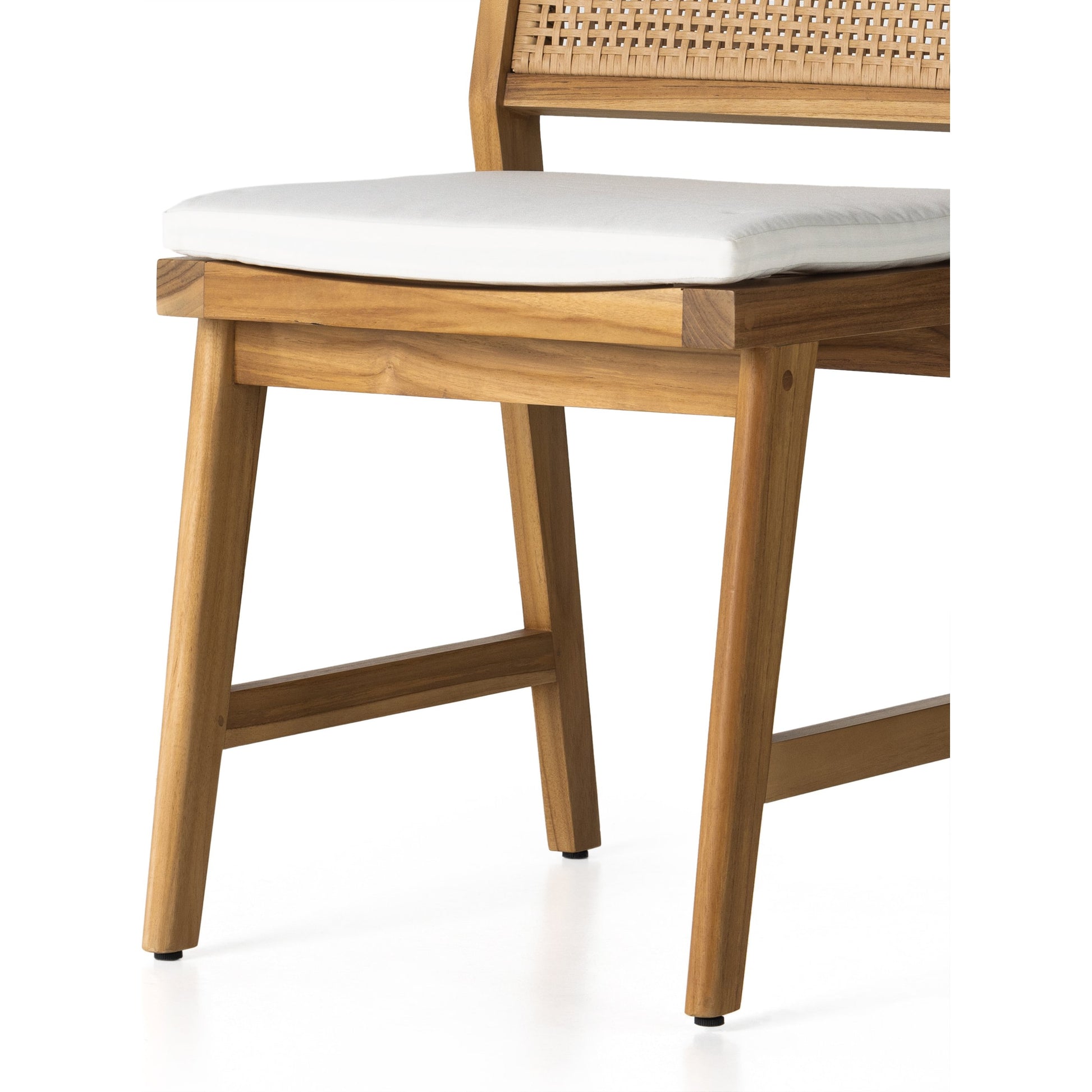 Merit Outdoor Dining Chair by Four Hands in faux rattan, natural teak. Made from solid fsc®-certified teak, 100% polyethylene in a transitional style.