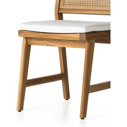 Merit Outdoor Dining Chair by Four Hands in faux rattan, natural teak. Made from solid fsc®-certified teak, 100% polyethylene in a transitional style.