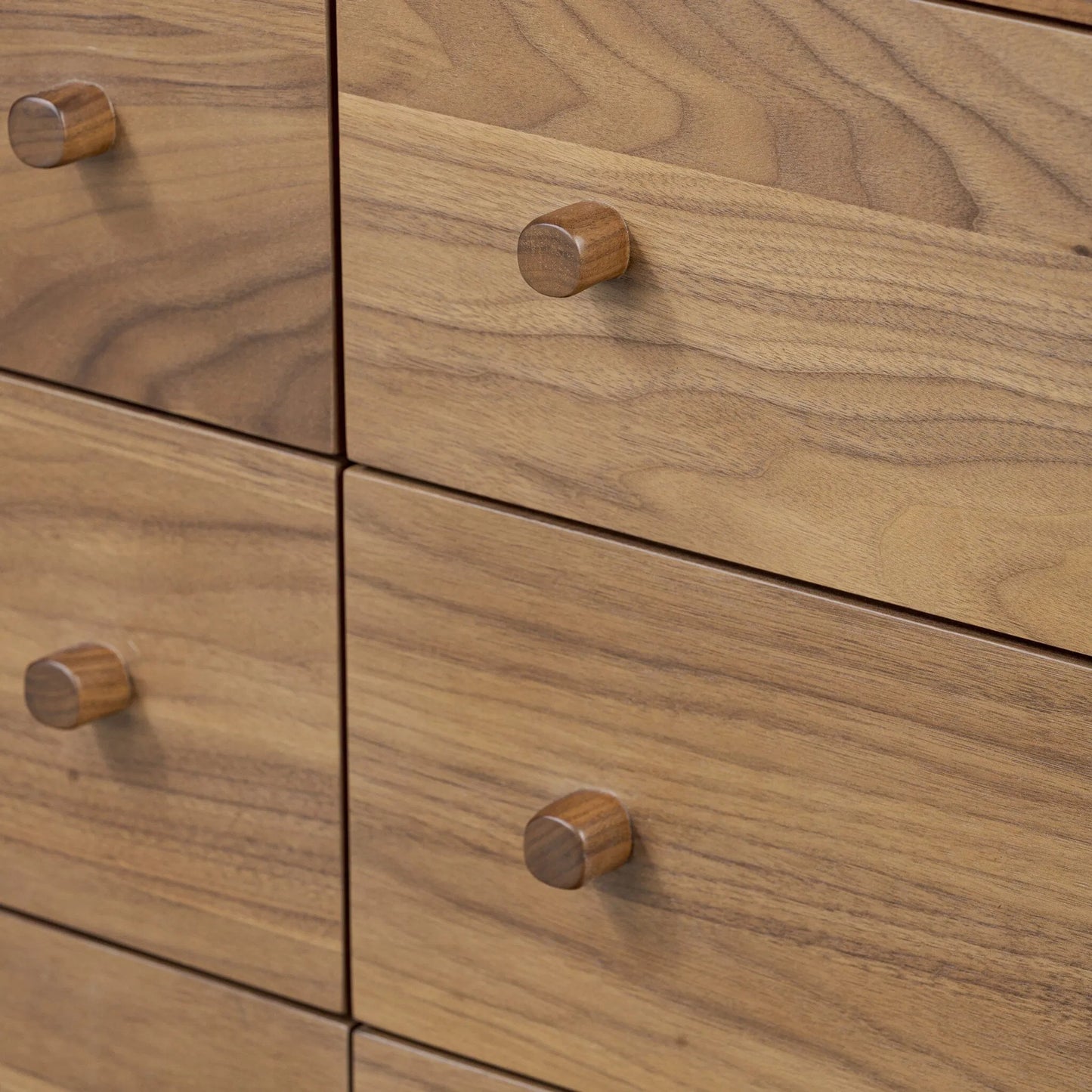 009 SI-2519077 | Closeup | Arturo 9 Drawer Dresser by Four Hands in natural walnut veneer. Made from walnut veneer, solid walnut in a unique style.