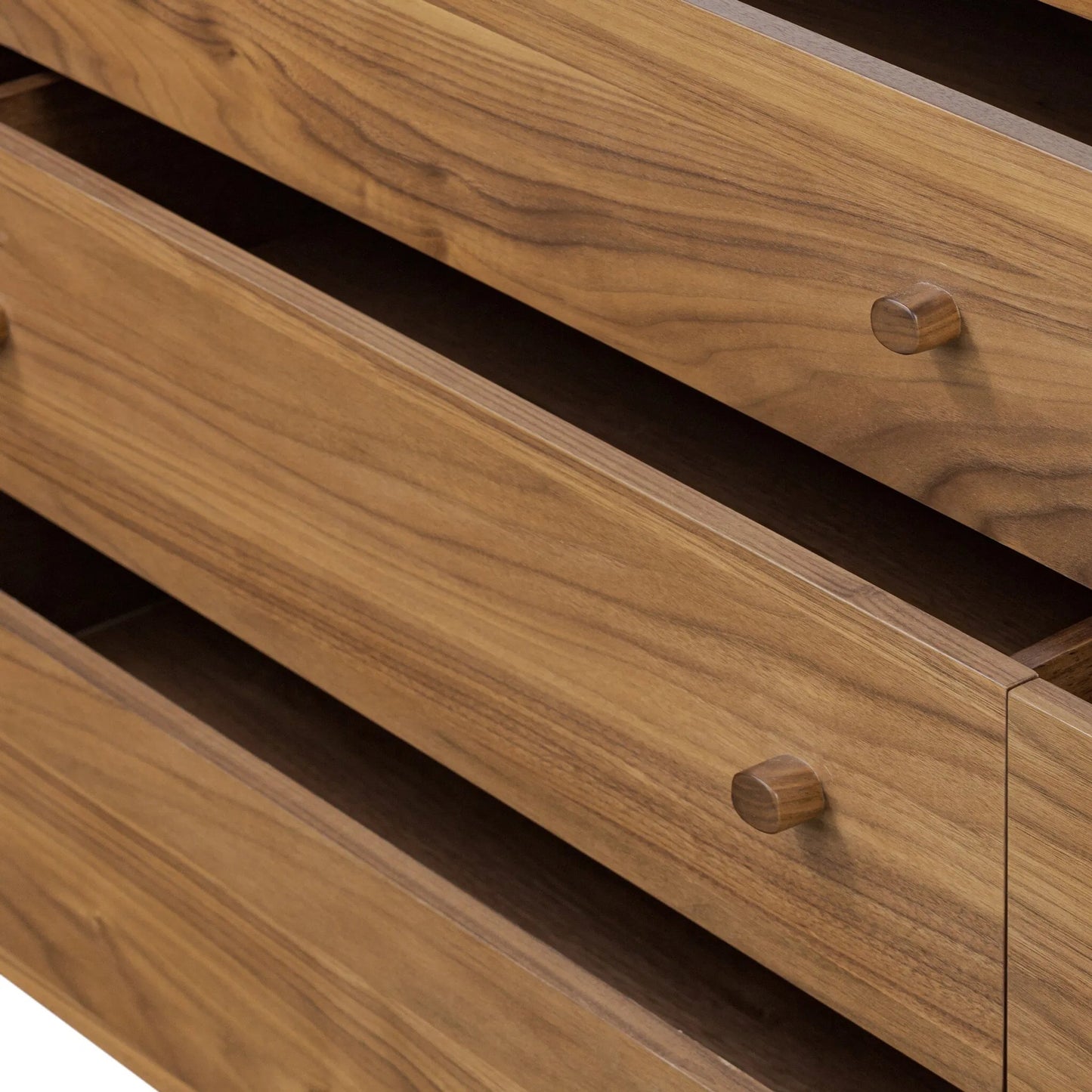 010 SI-2519077 | Closeup | Arturo 9 Drawer Dresser by Four Hands in natural walnut veneer. Made from walnut veneer, solid walnut in a unique style.