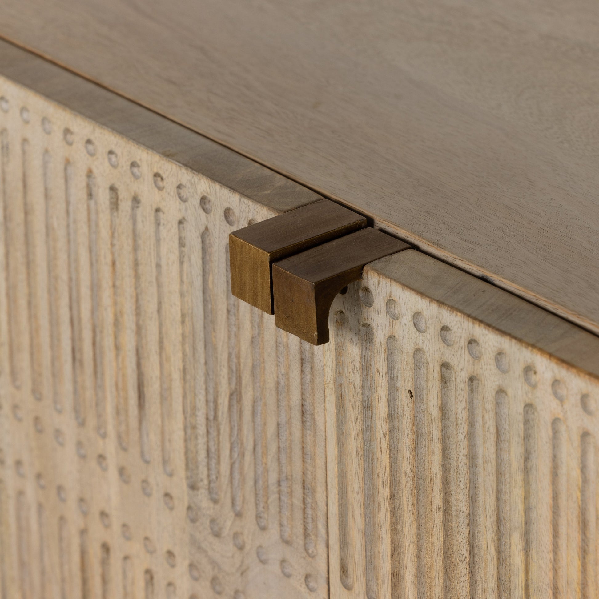 Kelby Closed Media Console by Four Hands in aged brass, carved vintage brown, vintage brown, gunmetal. Made from solid mango, iron in a modern style.