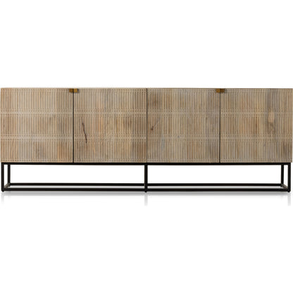 Kelby Closed Media Console by Four Hands in aged brass, carved vintage brown, vintage brown, gunmetal. Made from solid mango, iron in a modern style.