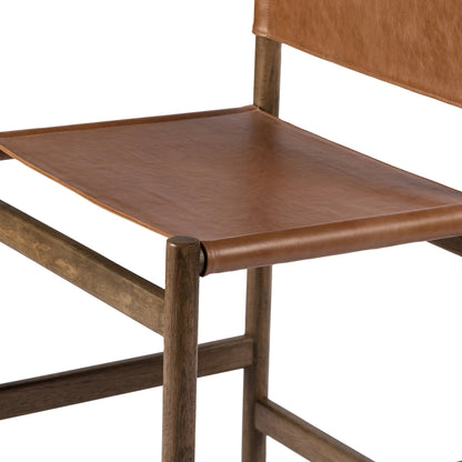 Kena Counter Stool by Four Hands. Made from solid parawood, top grain leather in a modern style.