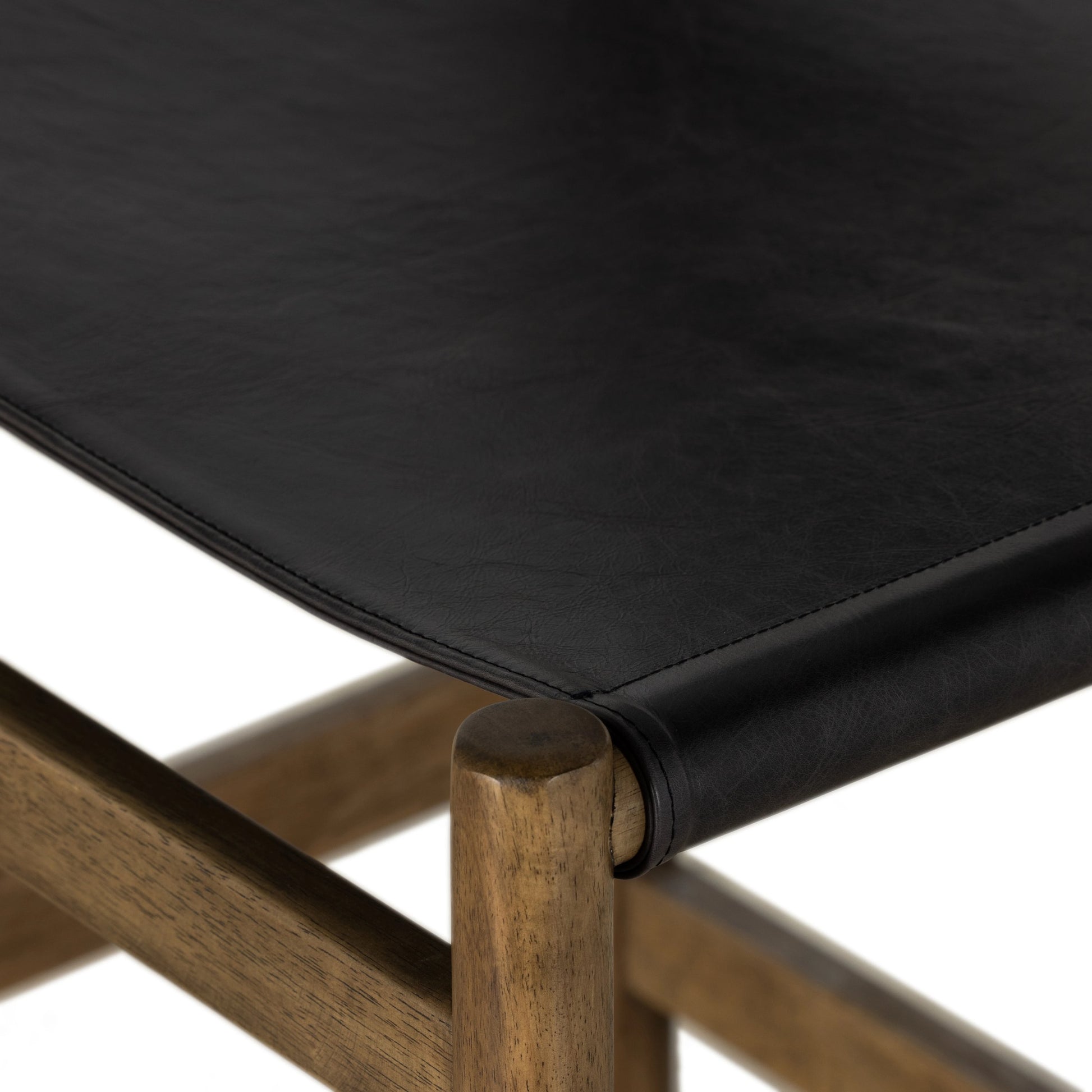Kena Bar Stool by Four Hands. Made from solid parawood, top grain leather in a modern style.