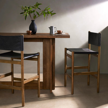 Kena Bar Stool by Four Hands. Made from solid parawood, top grain leather in a modern style.